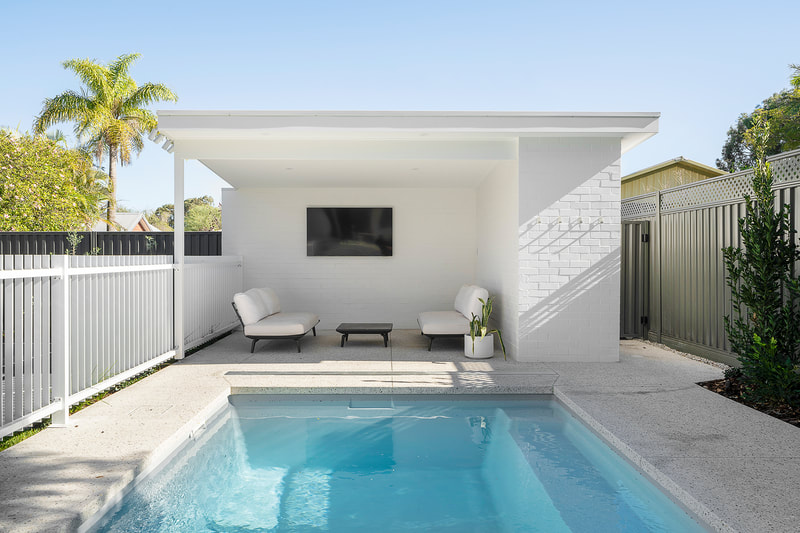 Pool House white painted brick Wembley Project Distinct Building Company