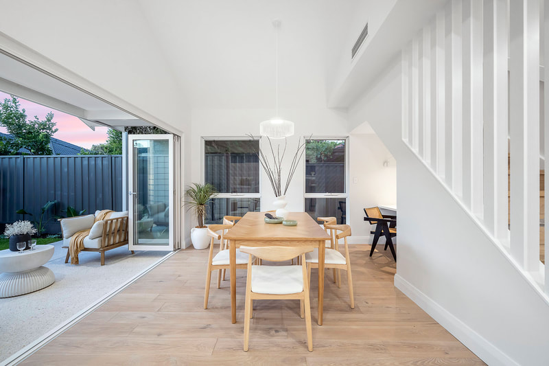 Dining in door outdoor flow Mount Hawthorn Distinct Building Company