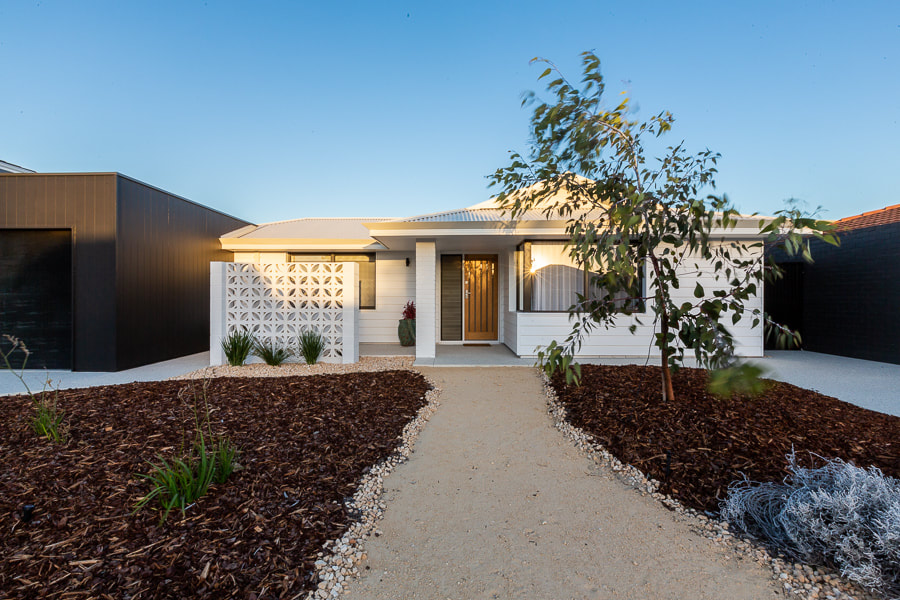 Coastal Home Exterior- White home Distinct Renovations Project