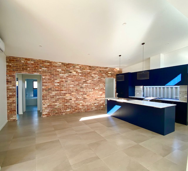 Spearwood New Built Navy Kitchen Feature brick wall