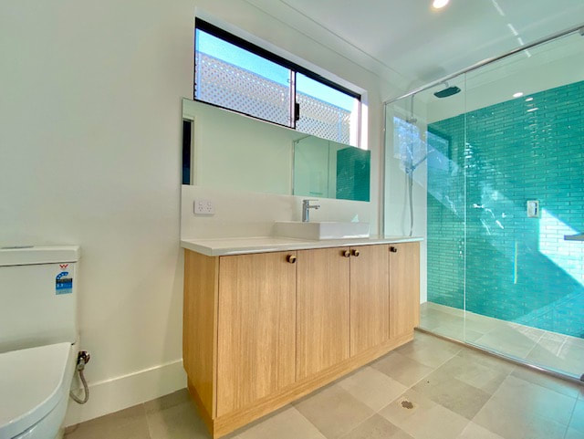 Ensuite Green feature tile timber vanity Distinct Renovations