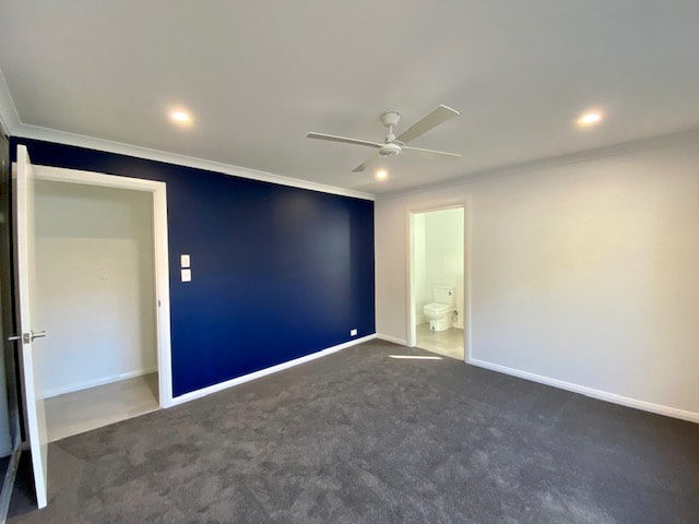 Master Bedroom Navy Blue feature wall Distinct Renovations Perth